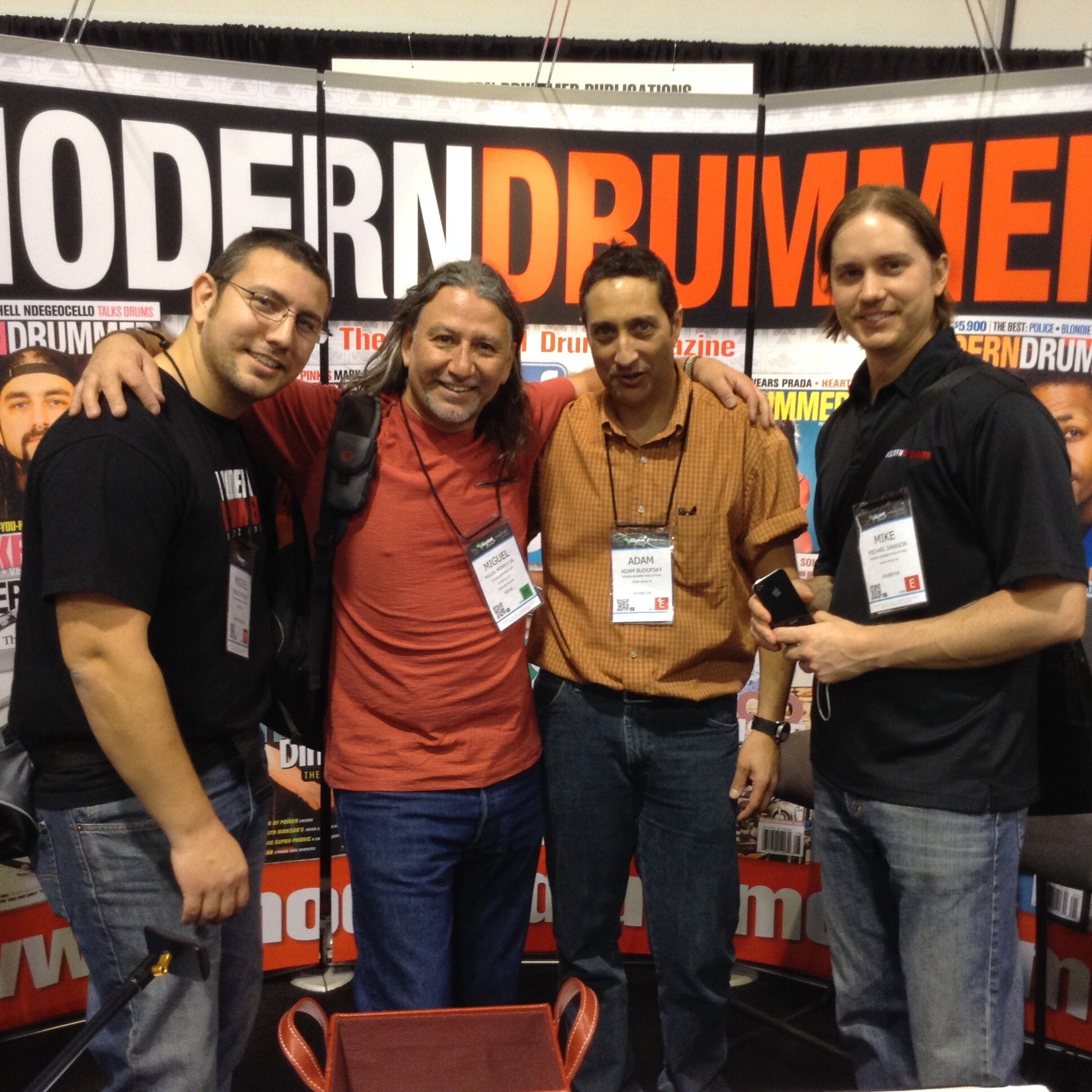 Miguel Monroy, Miguel Monroy Sr., Adam Budofsky, and Mike Dawson at the Modern Drummer booth.
